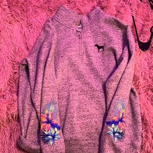 Pink XS grey half zip up with flower patterns on back of sleeve